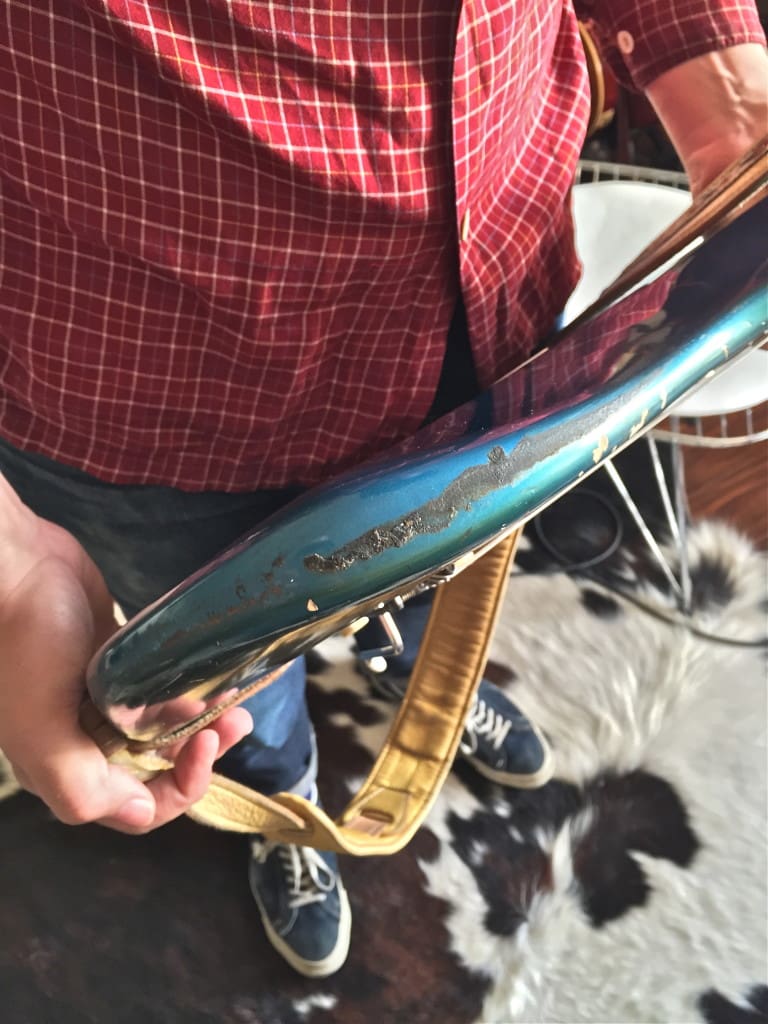 Residue from where the plastic body guard (now removed) joined the body. Over time, these body guards' gaskets would start to rot and eat away paint. 