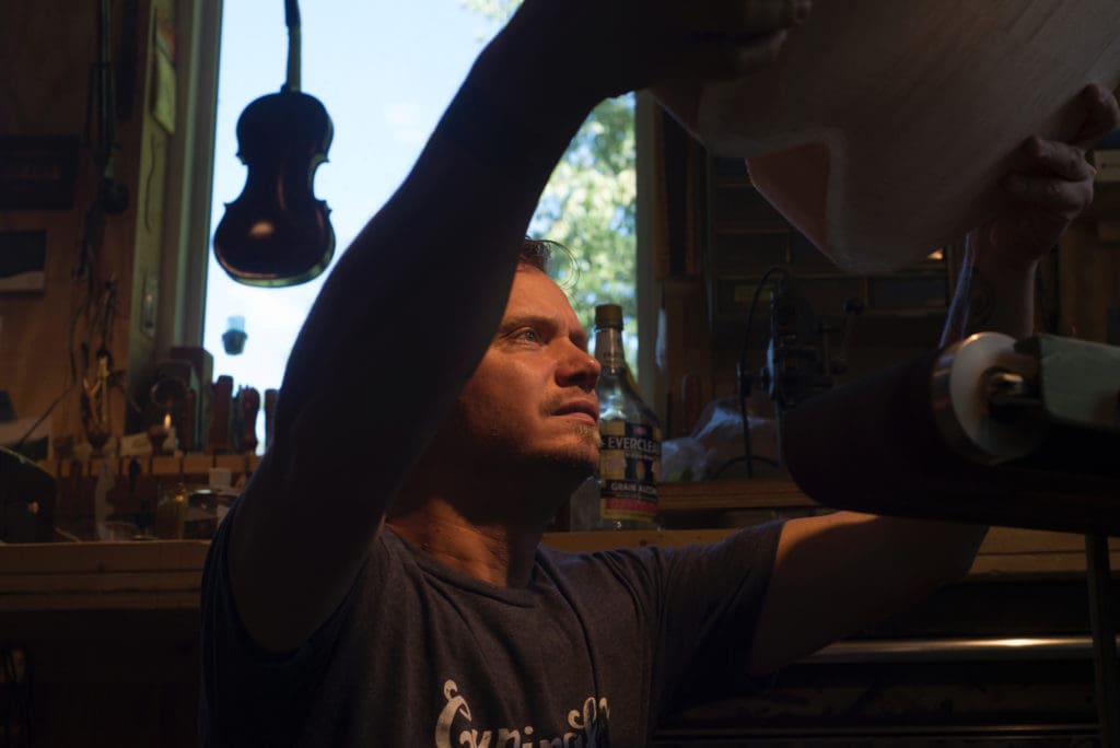 Luthier Jackson Cunningham of Cunningham Hand-Made Instruments makes archtop guitars and fiddles at his workshop in Troutdale, Virginia. Cunningham photographed on 9/3/16. Photo by Pat Jarrett/The Virginia Folklife Program